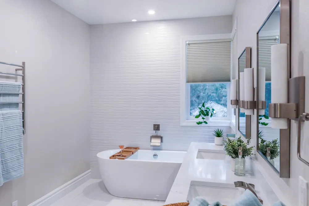 Freestanding tub and vanity in the remodeled primary bath